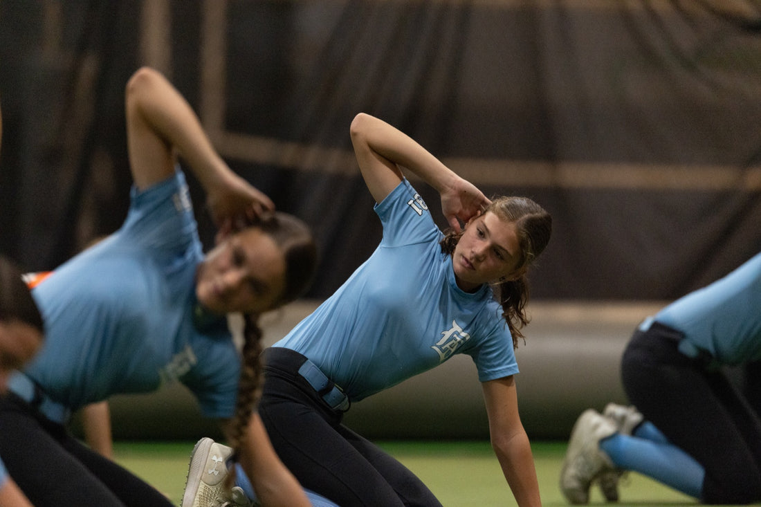 Athletes working through arm care and shoulder preparation at a High Level Throwing clinic